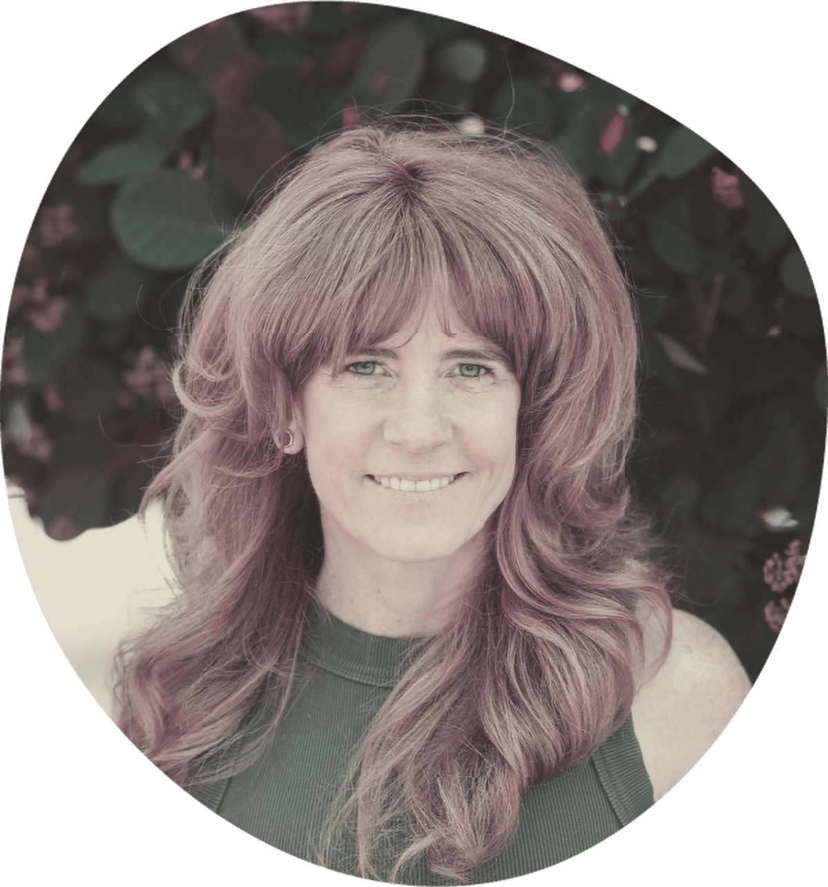 Yoga student practicing in a studio while following an online class on a laptop